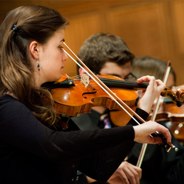 St. Scholastica students performing in a concert in the Mitchell Auditorium.