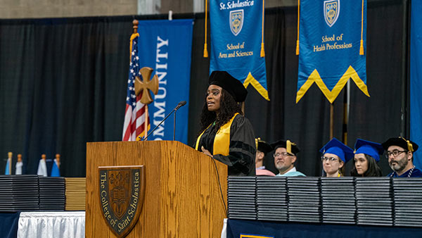 Photo of Ami Khan speaking at commencement