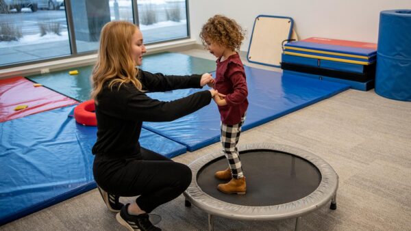 Occupational therapy student works with a child