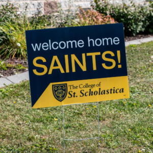 Welcome Home Saints sign for Welcome Weekend. Sign features St. Scholastica logo