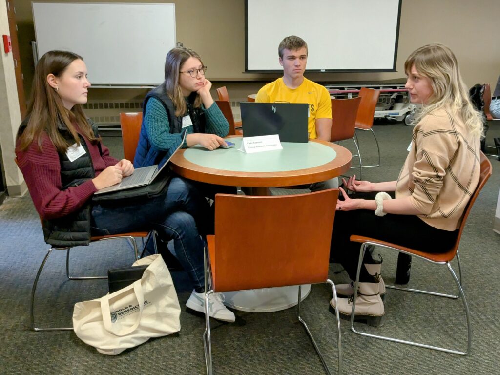 St. Scholastica students listen to a healthcare professional from Essentia Health.