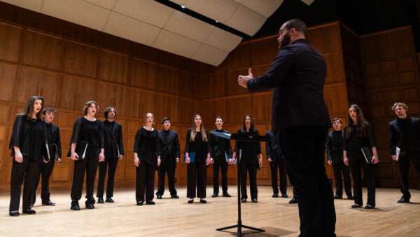 The St. Scholastica Chamber Choir directed by Dr. Richard Carrick pictured in the Mitchell Auditorium.