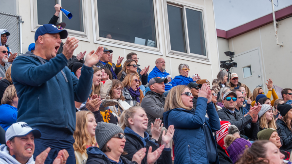 Crowd cheering at Homecoming.