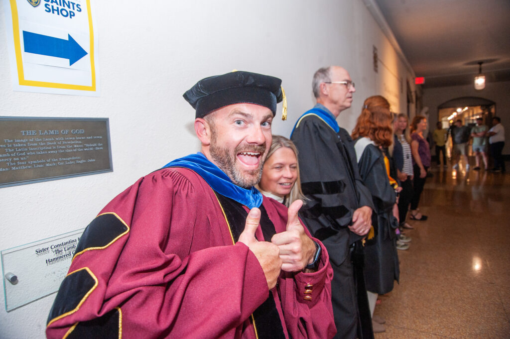 Faculty lined up on the first floor of Tower Hall to greet students for convocation.