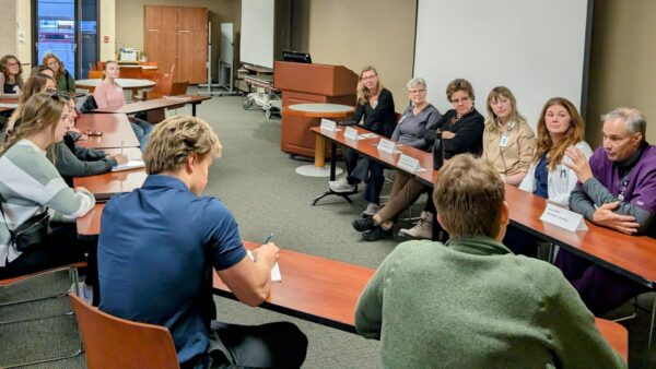 St. Scholastica students listen to professionals from Essentia Health at a panel.