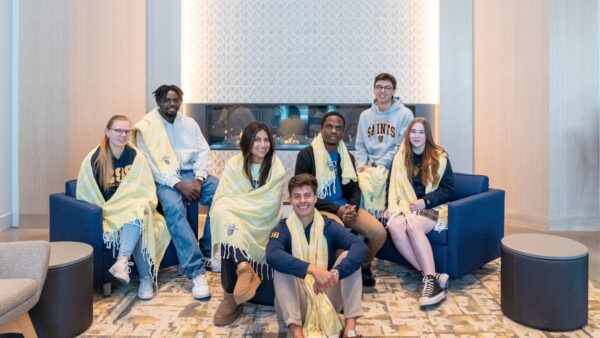 Group of students wearing branded Turkish towels for Give to CSS Day.