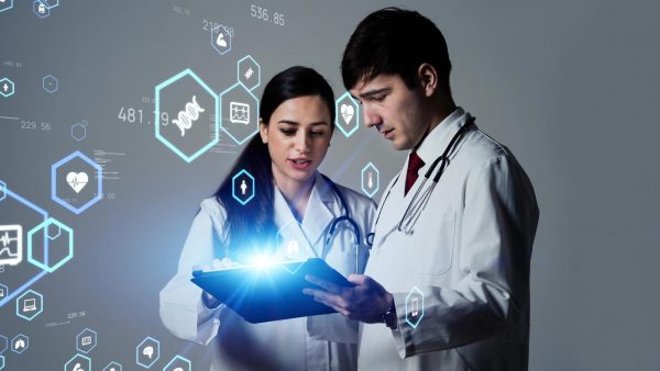 Doctors looking at a mobile device looking at healthcare data.