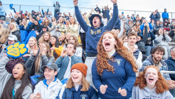 Student crowd cheering at Homecoming.