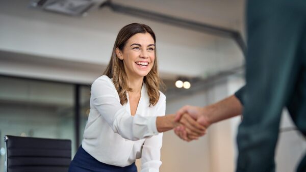 HR professional shakes hands with an employee