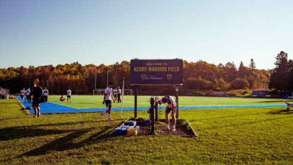 Soccer players practicing on the Kenny Harkins Field.