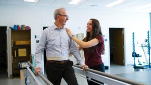 St. Scholastica PT student works with Maurice's Community Clinic patient.