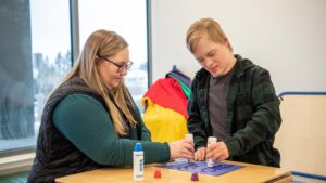 Occupational therapist works with a boy on dexterity at the Maurice's Community clinic