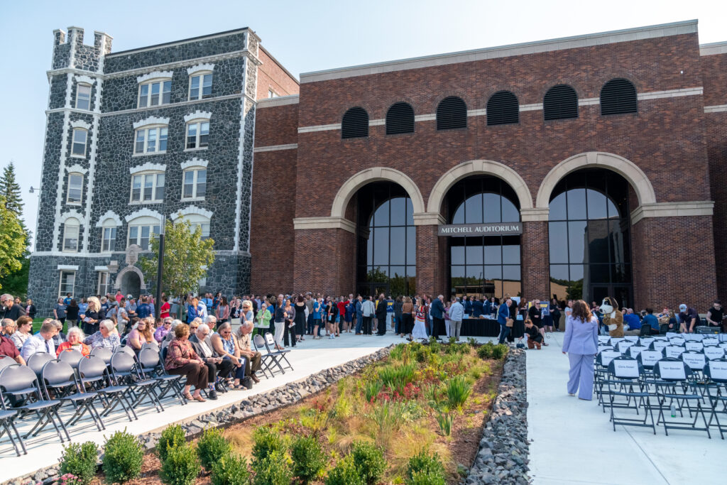 Crowd gathers outside the Mitchell Auditorium near the Student Center