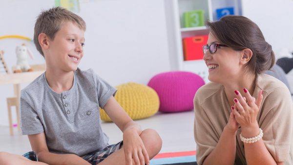 Teacher working with a student.