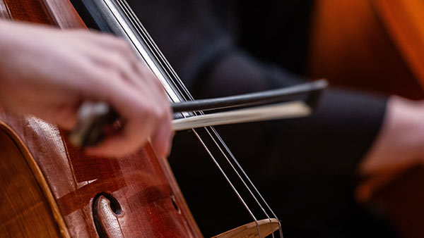 Student playing in the St. Scholastica Orchestra.