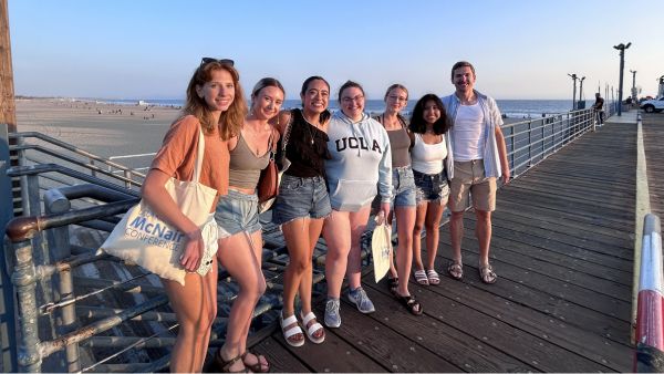 Group of seven TRIO McNair scholars at a pier in California.