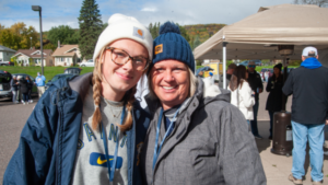 Two smiling individuals at Homecoming.